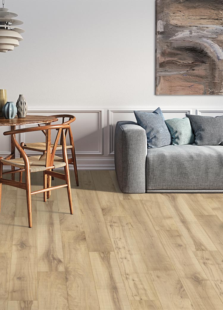 wood look laminate flooring in living room with grey couch and dining table